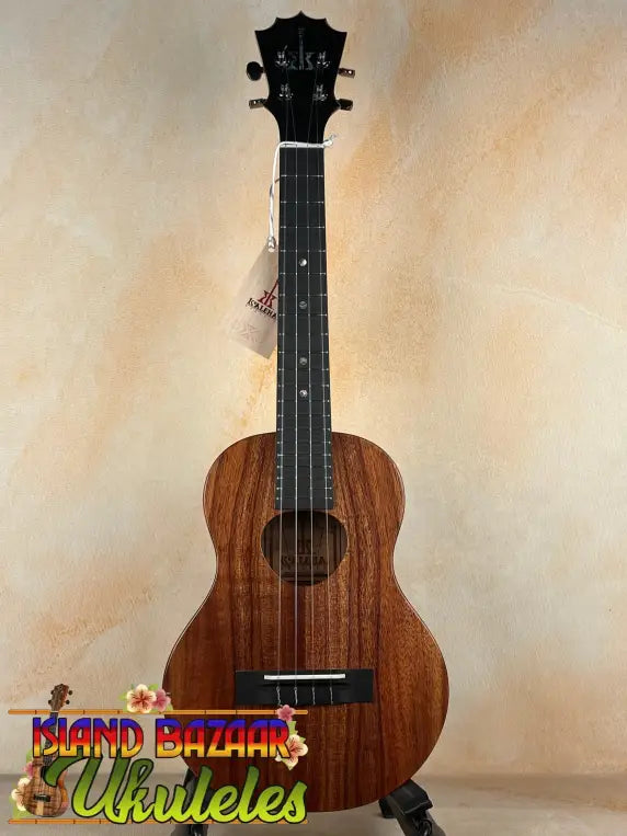 Brown KoAloha KTM-00 Tenor Ukulele with black fretboard for authentic Hawaiian sound