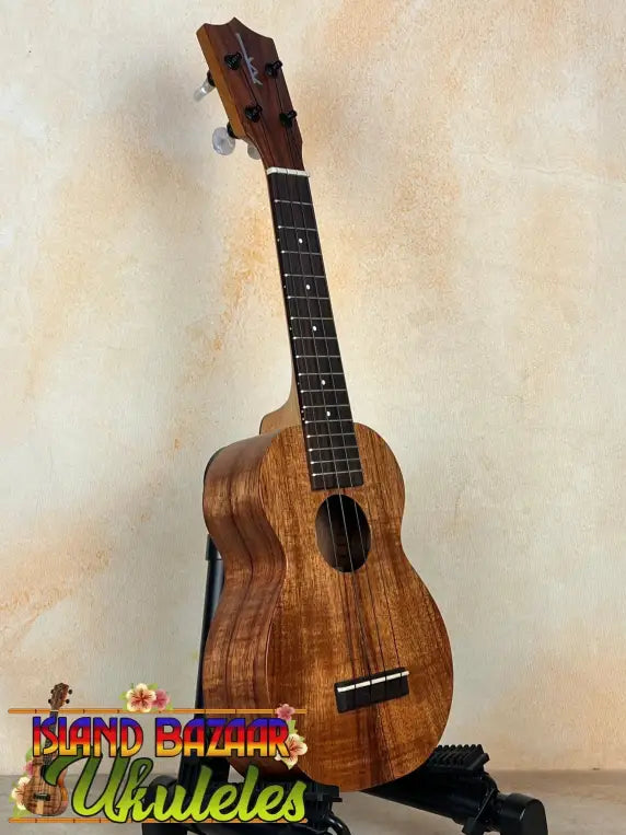 Wooden Kamaka Soprano Ukulele HF-1 showcasing rich solid Koa wood grain pattern