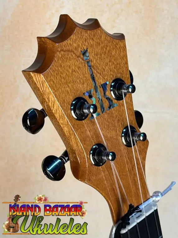 Guitar headstock with black tuning pegs on Beautiful KoAloha KTM-00 Mango Tenor Ukulele