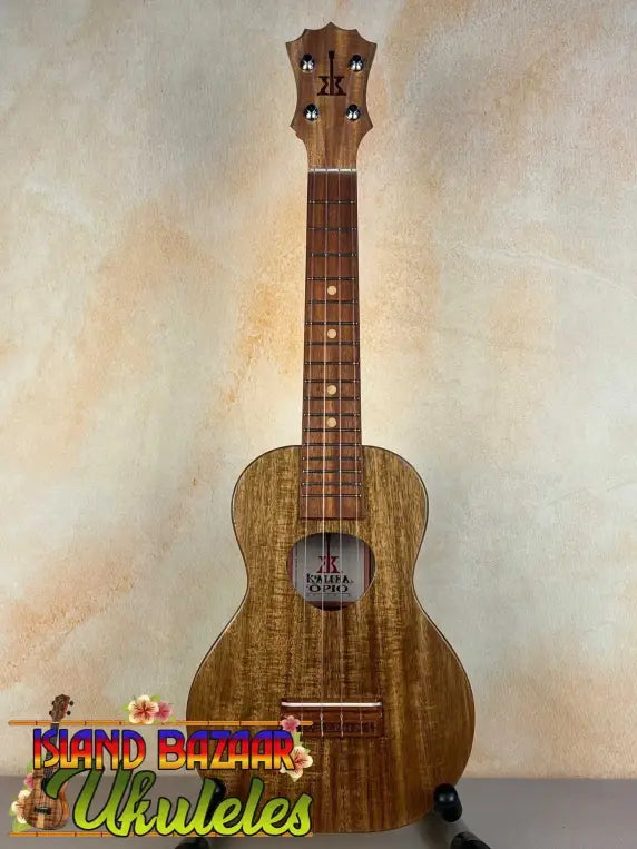 Wooden KoAloha Opio Concert Ukulele with natural grain finish and dark fretboard