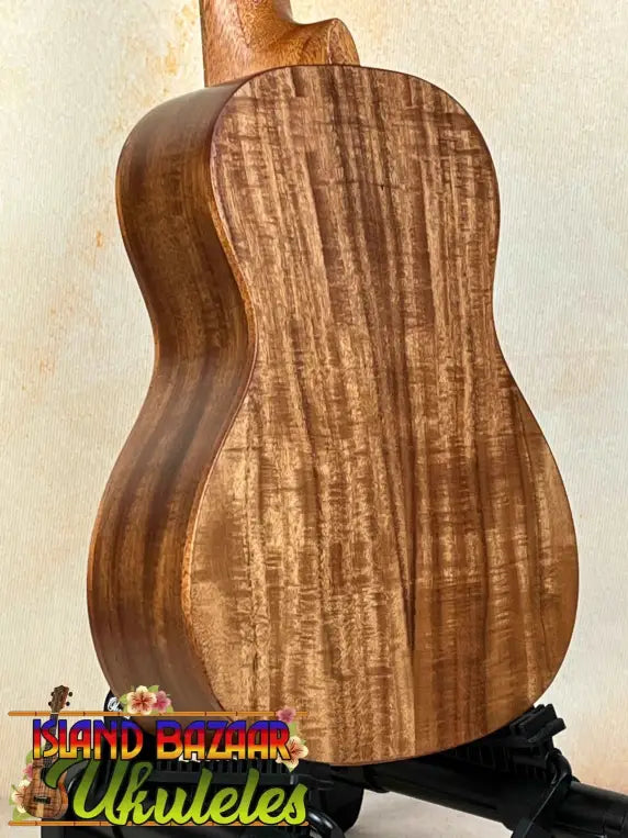 Acoustic guitar featuring figured Koa wood back for the Concert Acacia Ukulele beginners bundle