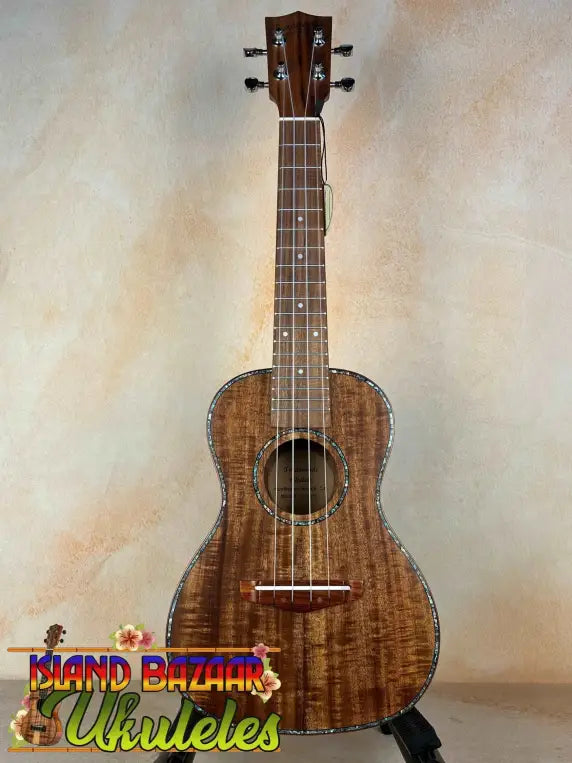 Beautiful koa wood Concert Acacia Ukulele with natural finish in beginners bundle