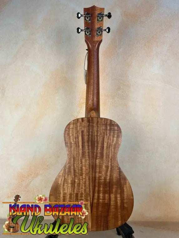 Wooden Concert Acacia Ukulele featuring koa wood grain in Beginners Bundle with accessories