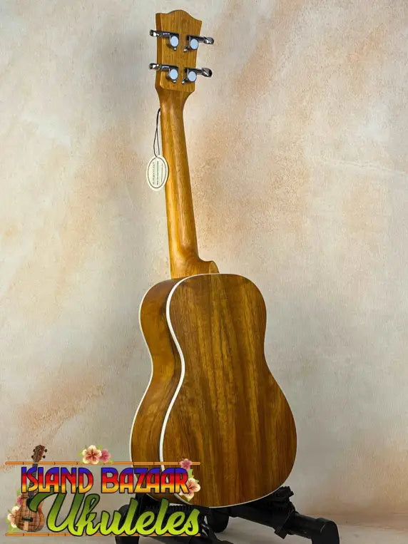 Wooden acoustic guitar with light binding in the Concert Mango Ukulele Beginners Bundle