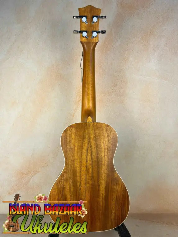 Wooden Concert Mango Ukulele with natural finish and black tuning pegs for beginners