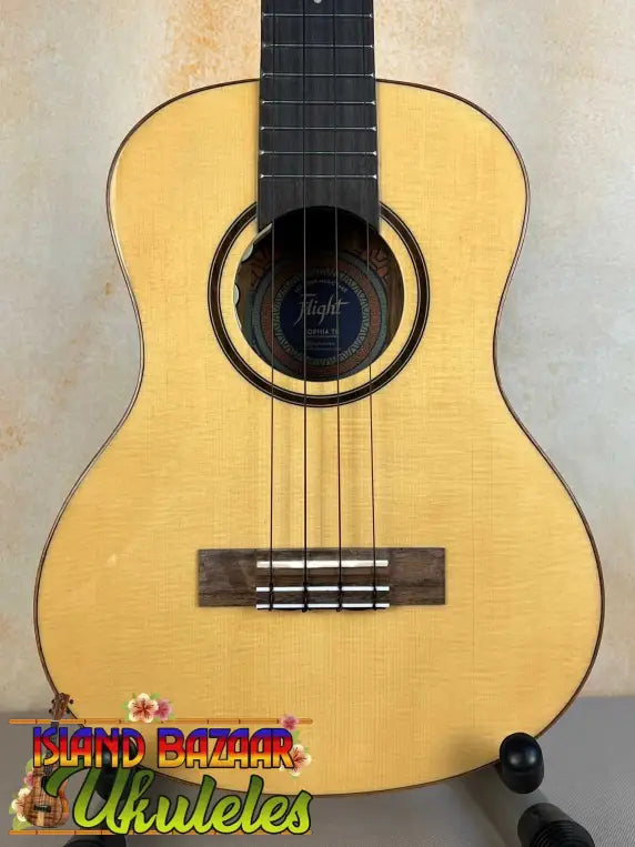 Natural wood Flight Sophia Soundwave tenor ukulele with black tuning pegs and dark fretboard
