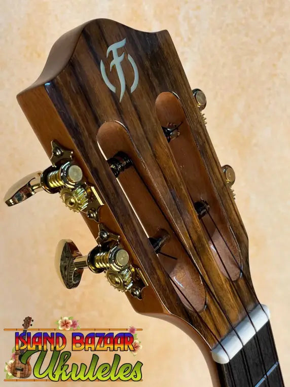 Guitar headstock of Flight Sophia Soundwave Tenor Uke with decorative inlay and tuning machines