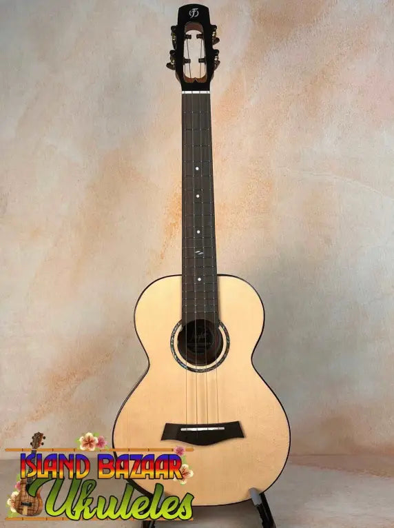 Natural wood acoustic guitar with a light body and dark neck for Flight Voyager Tenor