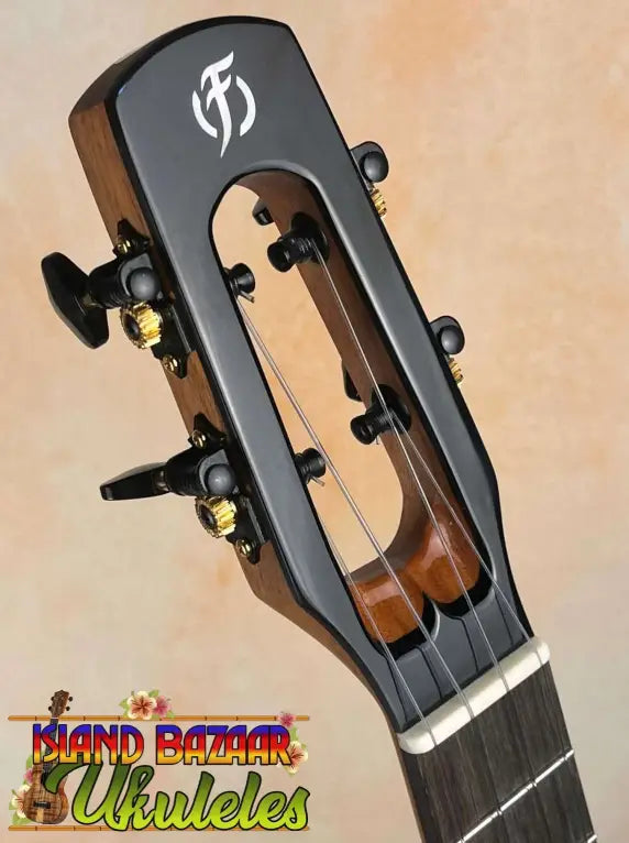 Guitar headstock with black tuning pegs on Flight Voyager Tenor Electro-Acoustic Ukulele