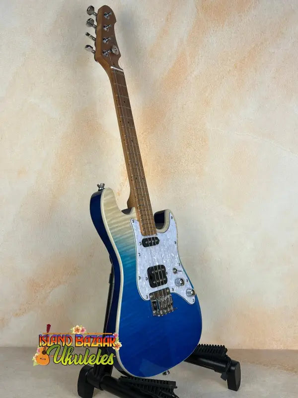 Blue and white Flight Pathfinder Tenor Electric Ukulele on a stand with maple neck