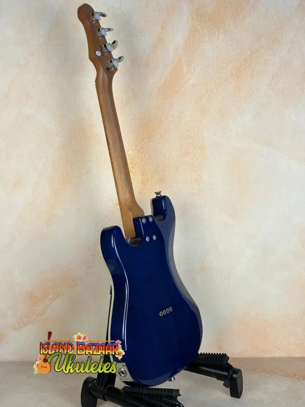 Navy blue electric guitar on black stand for Flight Pathfinder Tenor Electric Ukulele