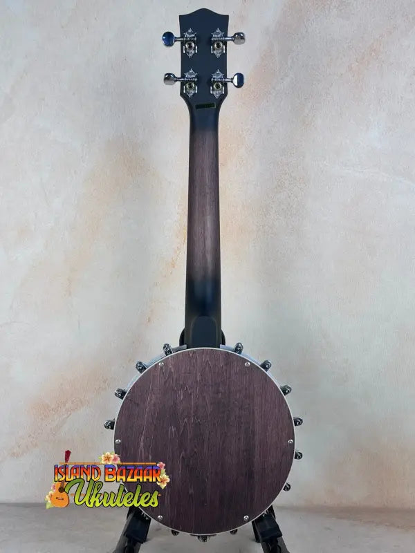 Five-string banjo with dark wood body, part of Gold Tone Concert-Scale Banjolele