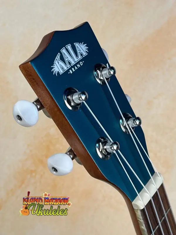 Kala Archtop Tenor Ukulele KA-JTE-BKGN headstock with white tuning pegs, classic archtop design