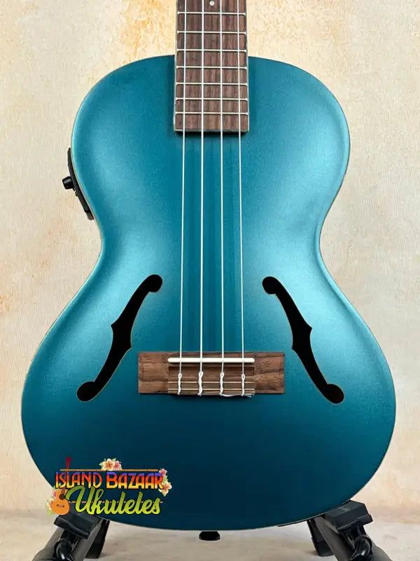 Metallic teal Kala Archtop Tenor Ukulele KA-JTE-BKGN with f-holes and wooden fretboard