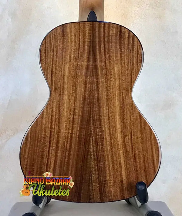 Acoustic guitar with rich brown wood grain for Cedar & Acacia Tenor Ukulele display