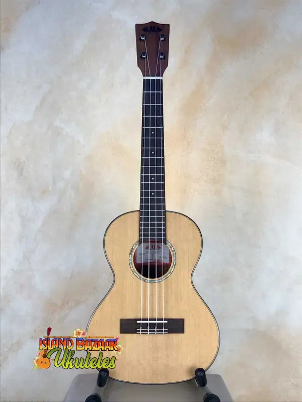 Natural wood Cedar & Acacia Tenor Ukulele on display stand at Island Bazaar Ukes