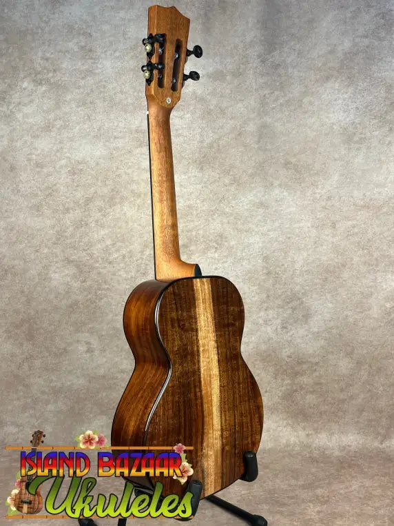Kala Contour Series Tenor Ukulele with solid acacia wood and striped back on stand