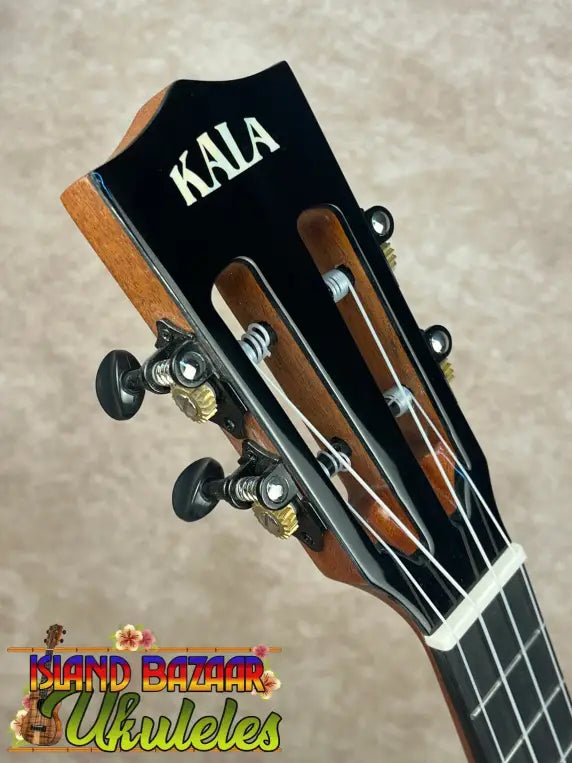 Headstock of Kala Contour Series Tenor Ukulele with solid acacia wood and tuning pegs