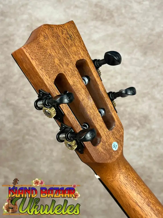 Back of Kala Contour Series Tenor Ukulele with solid acacia neck and black tuning pegs