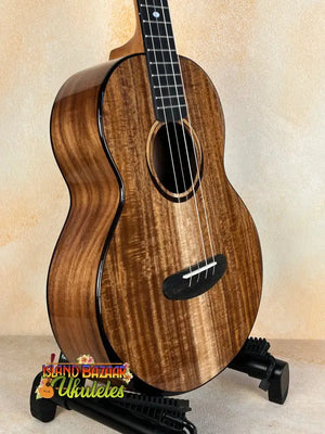 Beautiful koa wood tenor ukulele with black binding featured in Kala Contour Solid Acacia