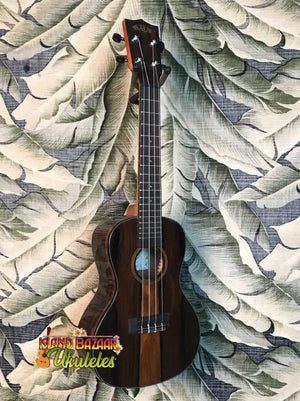 Dark wooden Kala Ziricote Ukulele with four strings from the Gloss Ziricote Series
