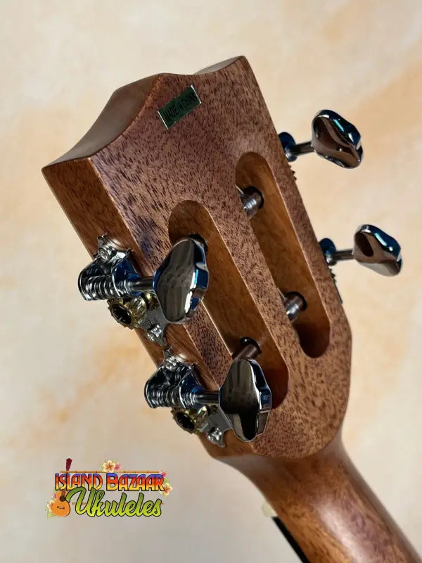 Wooden guitar headstock with black tuning pegs from Kala KA-SMH-TG Solid Mahogany Tenor Ukulele