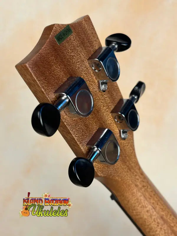 Guitar headstock with black tuning pegs on Kala SA-C Concert Ukulele in Spruce & Acacia