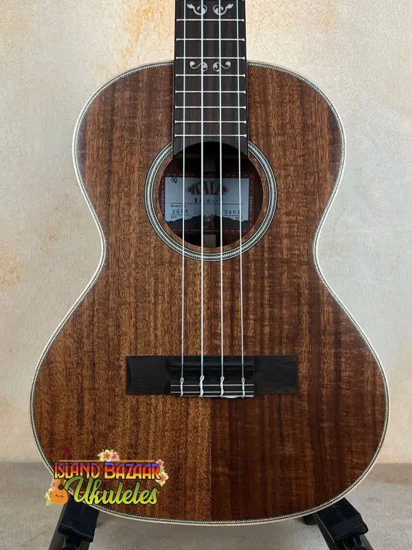 Wooden Kala SA-T Tenor Ukulele with dark brown grain and black fretboard for rich tone