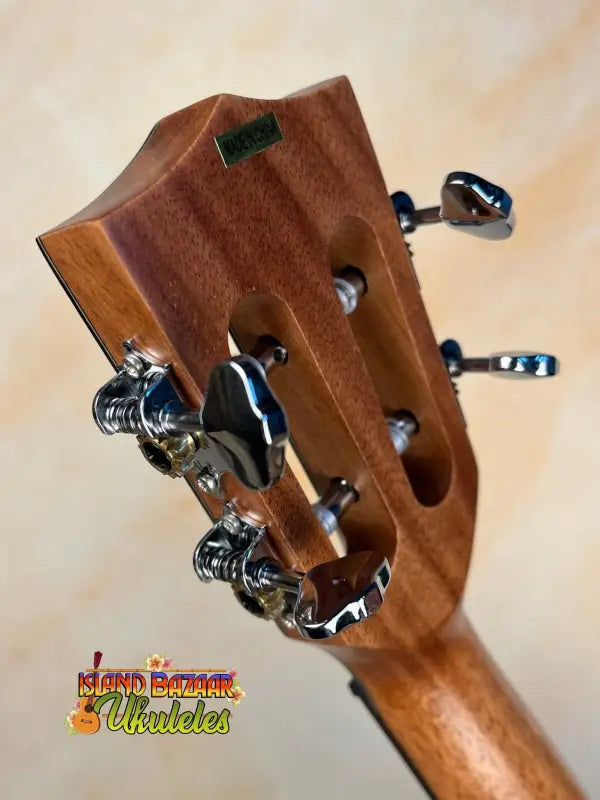 Wooden guitar headstock with metal tuning pegs on Kala SA-T Tenor Ukulele