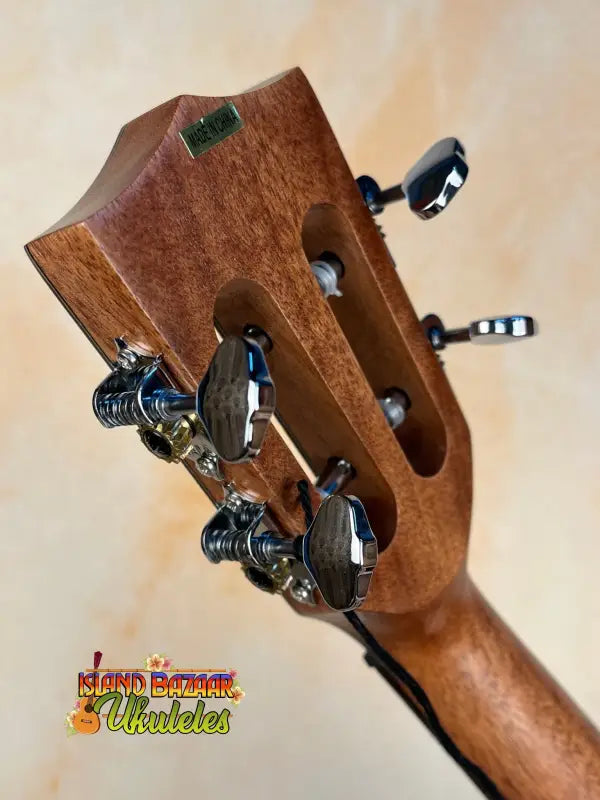 Wooden guitar headstock with metal tuning pegs on Kala SA-TE-C Tenor Electric Ukulele