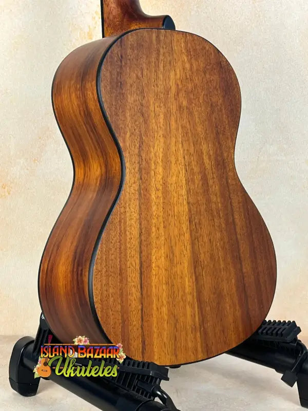 Wooden Hawaiian Koa tenor electric ukulele with rich brown mahogany finish