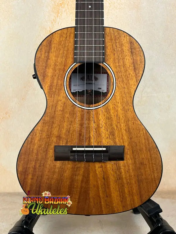 Wooden Kala Satin Hawaiian Koa Tenor Electric Ukulele with rich mahogany finish