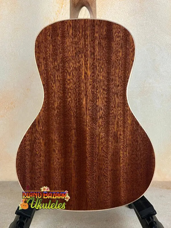 Acoustic guitar with rich mahogany back, showcasing Kala SMH-CG Concert Ukulele elegance