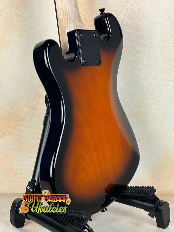 Sunburst-colored Kala Solid Body 4-String Tobacco Burst Fretted U•BASS® on stand