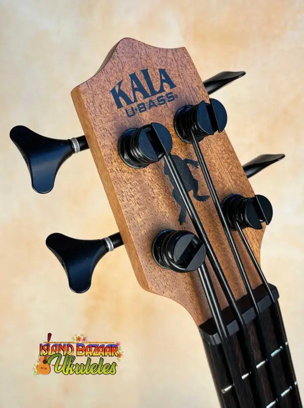 Kala U-Bass Nomad headstock with black tuning pegs for an acoustic-electric bass ukulele