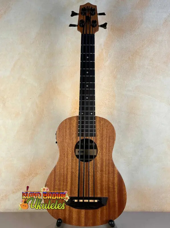 Wooden Kala U-Bass Nomad Acoustic-Electric Bass Ukulele with dark fretboard and four strings