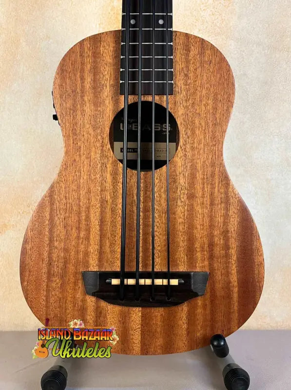 Wooden Kala U-Bass Nomad Acoustic-Electric Bass Ukulele with black fretboard and bridge