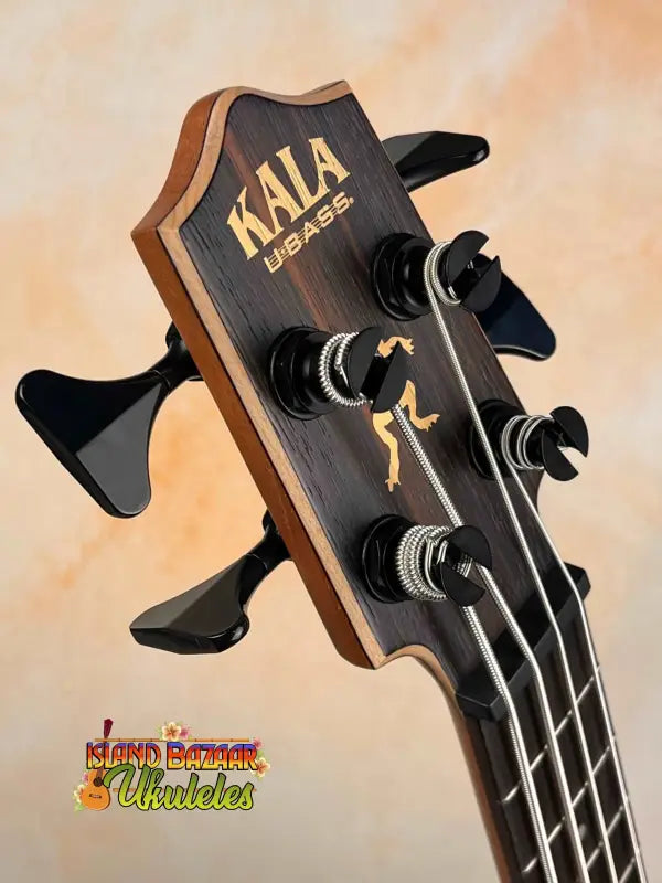 Kala UBASS-EBY-FSRW Striped Ebony Acoustic-Electric bass ukulele headstock with gold logo