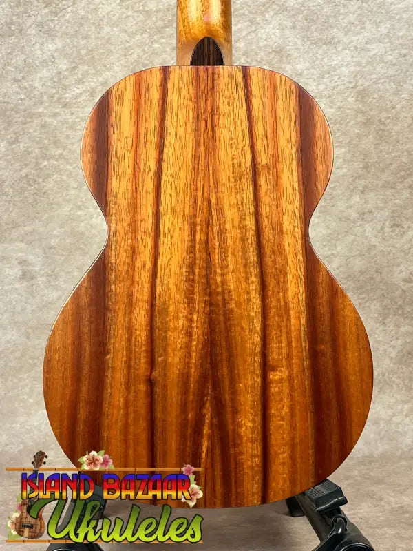 Wooden ukulele back showcasing the Kamaka HF-3 Tenor Ukulele in Hawaiian Koa tone