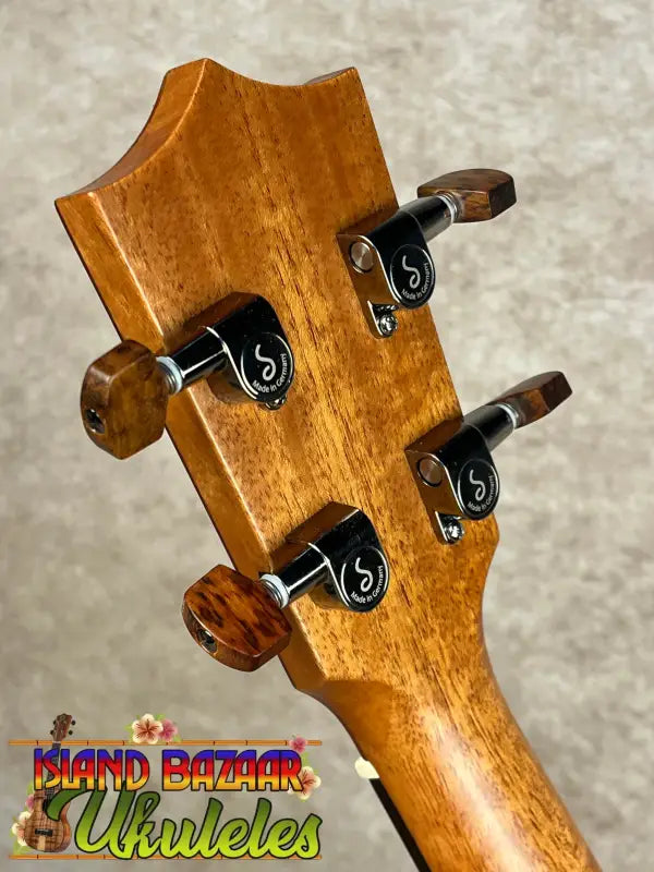 Ukulele headstock with tuning pegs on Kamaka HF-3 Tenor Ukulele in Hawaiian Koa tone