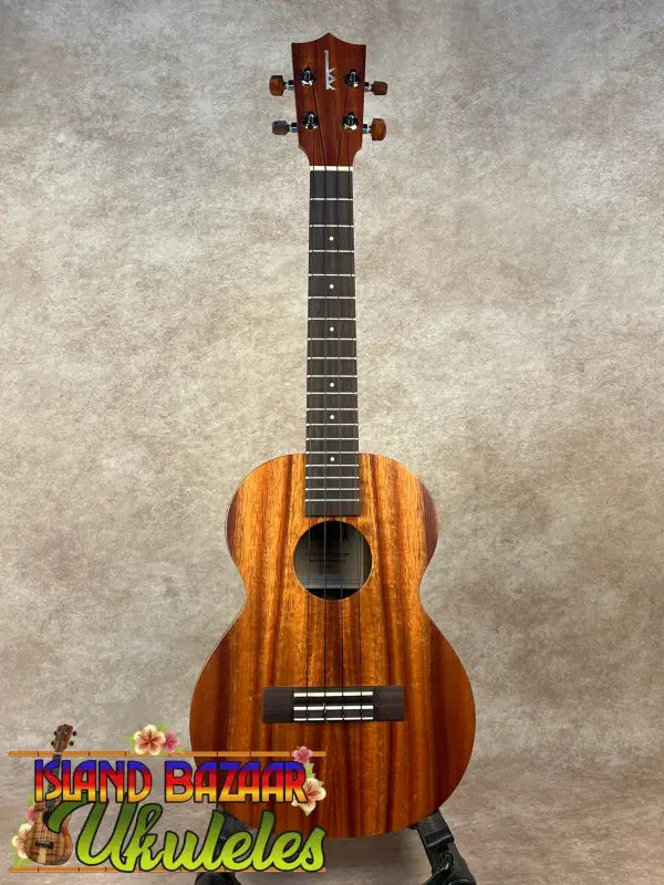 Brown wooden Kamaka HF-3 tenor ukulele from the Hawaiian Koa Tone Machine collection