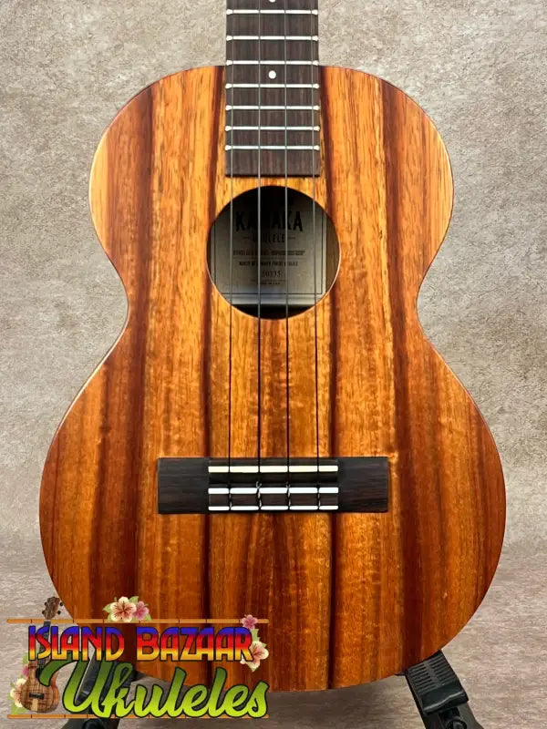 Wooden Kamaka HF-3 tenor ukulele with dark fretboard for classic sound and style