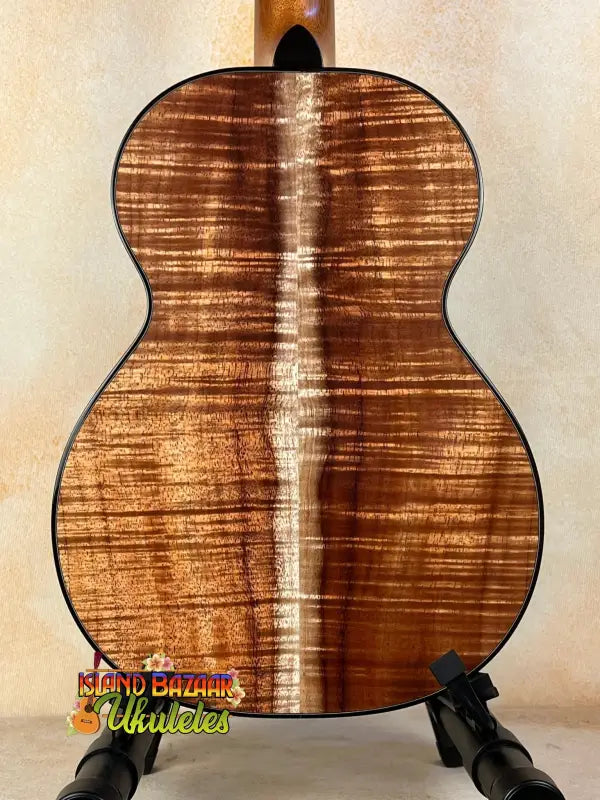 Acoustic guitar with koa wood back showcasing Kamaka HF3-D2i Tenor Uke Deluxe