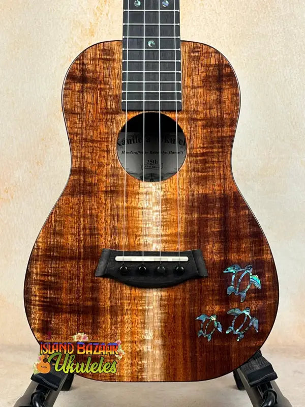 Beautiful Koa wood Kanile’a Concert Ukulele with dolphin inlay and deluxe gig bag