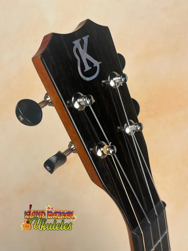 Ukulele headstock with tuning pegs on Kanileʻa D-1 Tenor Ukulele in solid Hawaiian koa