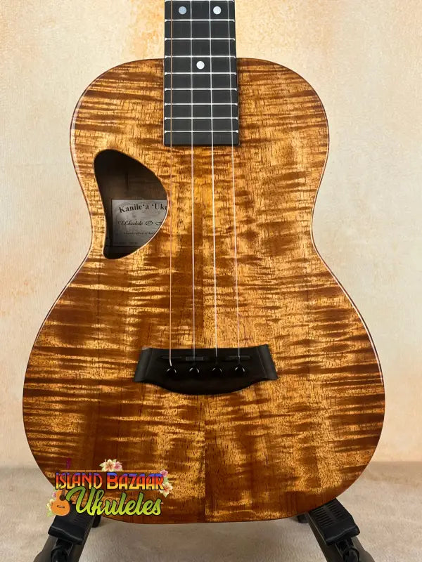 Brown wooden Kanileʻa D-1 T Pro Tenor Ukulele made from solid Hawaiian koa with deluxe gig bag