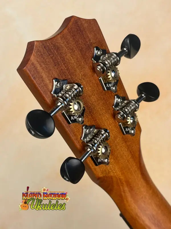 Ukulele headstock with tuning pegs on Kanileʻa D-1 T Pro Tenor Ukulele solid Hawaiian koa with deluxe gig bag
