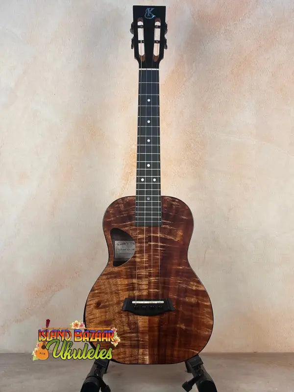 Beautiful Koa wood Kanile’a DK-T D-Hole Tenor Ukulele with black tuning pegs