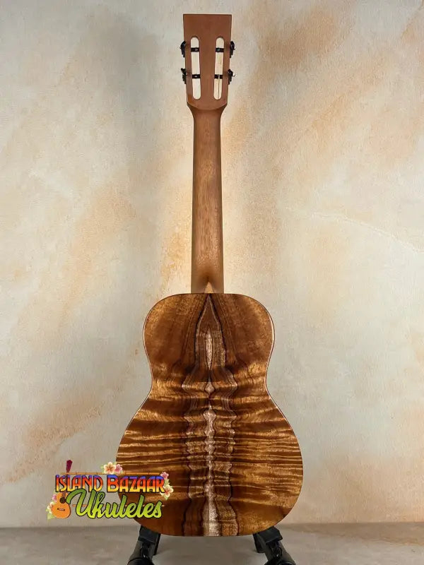 Wooden ukulele back showcasing premium koa on Kanile’a DK-T Pro D-Hole Tenor Ukulele