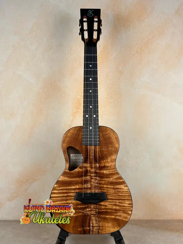 Brown wooden Kanile’a DK-T Pro Tenor Ukulele with d-hole design and sound port